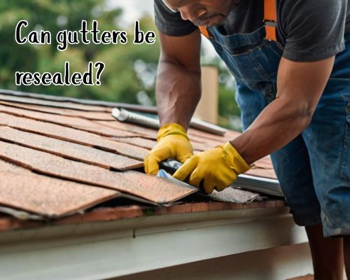 Sealing roof gutter to prevent leaks.